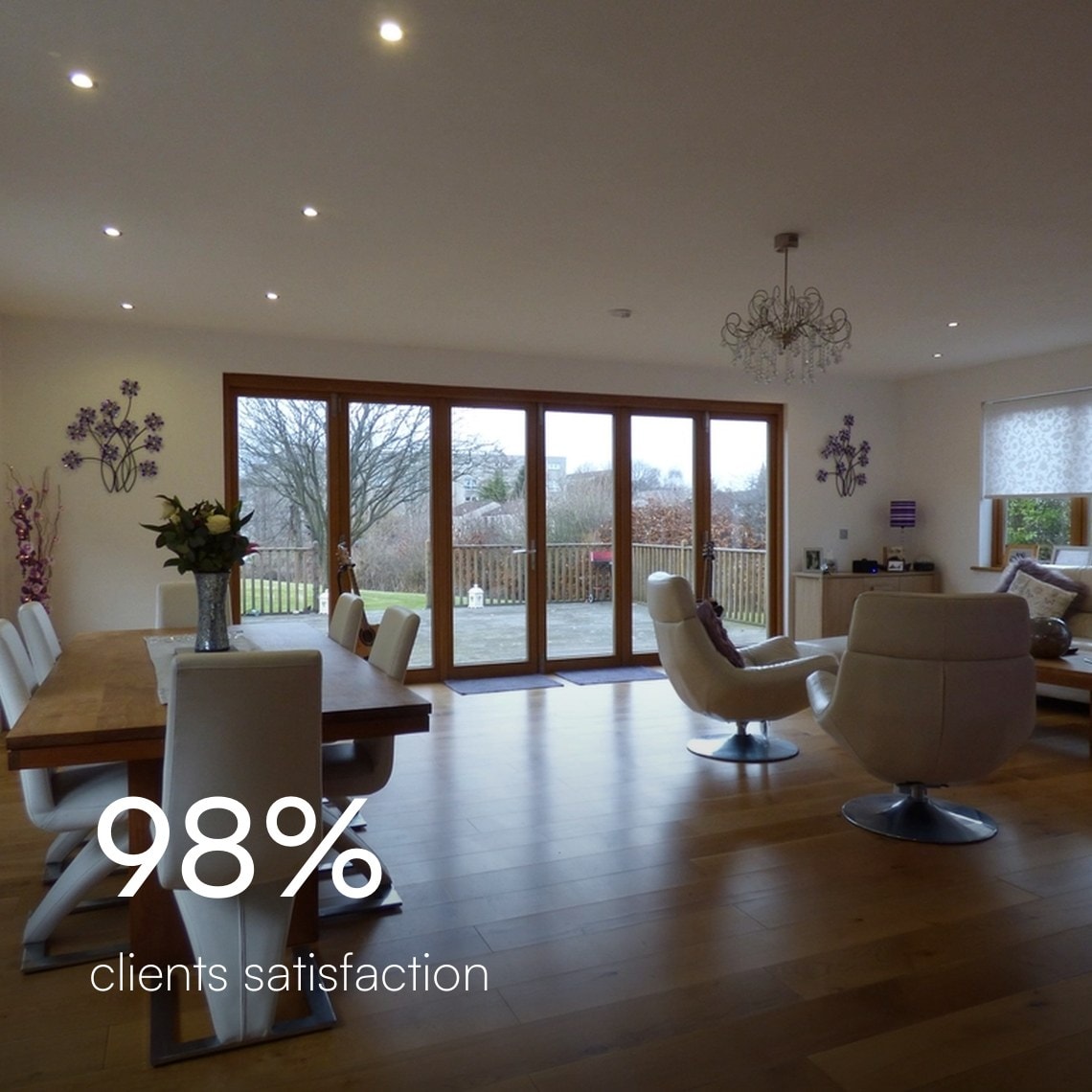 Open dining and living room with a wide oak plank floor, 98% client satisfaction