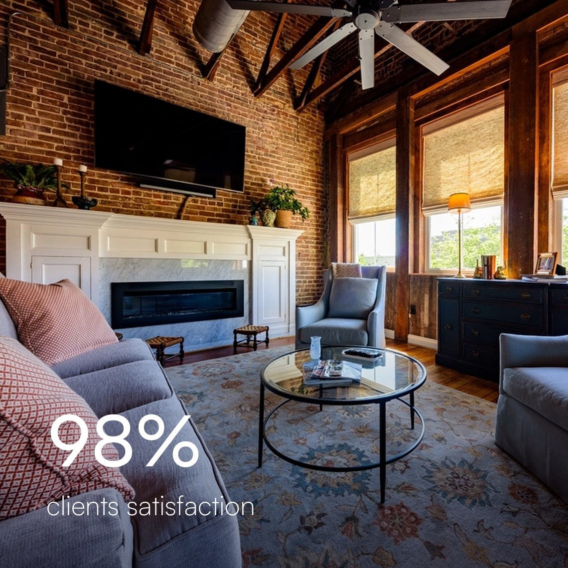 Brick-walled living room with a TV mounted over the fireplace and woven window shades, 98% client satisfaction